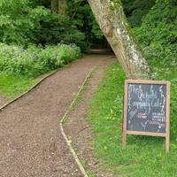 Continue past the orchard building on your left where you can get refreshments at the community café