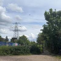 Just before the bus-stop you see a gravel opening. It’s an unassuming start to the canal that connects to the Grand Union Canal 5 miles away