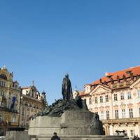 Around the square you’ll see the Jan Hus Memorial and the Gothic towers of the Church of Our Lady before Týn.