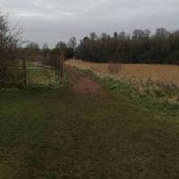 Keep ahead as the path enters a narrow stretch between the riverbank and a fence. Note the old beacon to guide ships on the opposite bank.