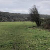 As the ridge emerges ahead, take a right into the field and walk towards the church.