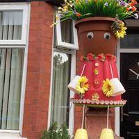 Look for the fun decorations on some of the houses on the right of the street
