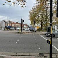 Start Section 6 by using the pedestrian crossing to cross Gloucester Road towards Muller Road.