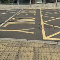 Cross the bus gate and head away from the Orbital on the pavement