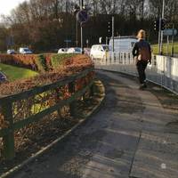 Now turn right along the pavement, which bears left so that you have the McDonald's Carpark & buildings to your left.