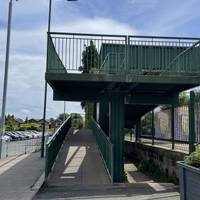 Cross the accessible bridge over the platform.