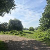 As the path bends around the corner, take the grass path on the right.