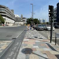 Continue along the path, past the entrances to the car parks. There is a slight camber here but no steps or kerbs to navigate.