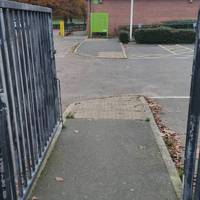 Cross the car park heading towards the Sports Pavilion.