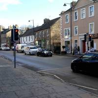 With your back to the square, turn left to head east along the High Street. Cross the road at the pedestrian crossing.