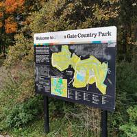 At the board showing a map of Moses Gate Country Park, put the lake behind you and turn right along the shore for a few metres.