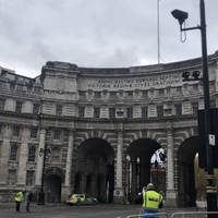 Follow the curve of the road as it bends right to enter The Mall. Head under the large stone Admiralty Arch and stay on the right-hand side.