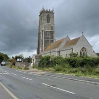 Walk towards Holy Trinity and All Saints church with the large tower