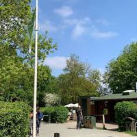 With the flagpole next to toilets behind you, carefully walk down the main car park and take second exit on your right