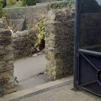 Turn left through a gap in the stone wall to exit the platform.