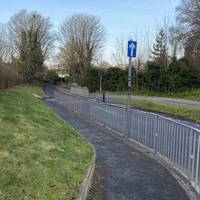 With the school gates behind you, turn left and head down Mount Road on the tarmac path.