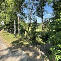 Just pass the small green, head right through a gate onto a footpath. It can get quite overgrown with nettles in summer.