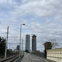 After the tramway crossing, turn left to follow the footway up to the pedestrian crossing on your right hand side.