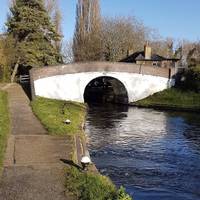 Cross the canal on bridge 184 at Uxbridge Lock. Continue along the towpath on the other side.