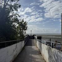 To the left of the station entrance, head over the bridge on the right to walk over the railway line.