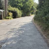 The pavement stops here but there are few cars.