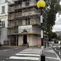 Use the zebra crossing to cross Gloucester Terrace.