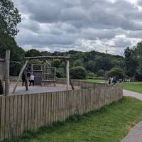 Follow the path past the enclosed playground.