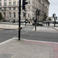 Cross over the road towards the Pier Head