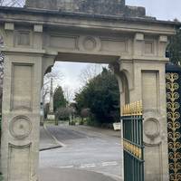 Once back up on the flat, pass though these gates, carefully cross the road and continue on the pavement on the other side past the obelisk