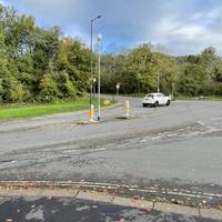 At the traffic junction, cross Bridge Valley Road using the traffic island.
