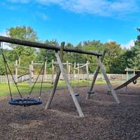 Walk past the play park heading towards the visitor centre and cafe.