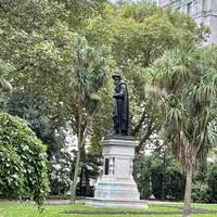 Walk through the gardens passing the statue of William Tyndall at the far end.