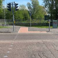 Head out of the park to the pedestrian crossing and keep going straight along the road.