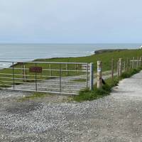 Take the footpath alongside the coast towards the hotels.