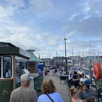 Let’s head out. You’re heading to the right, on the walkway along the quays. You’ll pass some public toilets on your left.