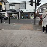 Use the dropped kerb to cross the lay-by.
