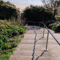 Take the stairs down to the beach promenade.