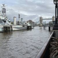 Walk right through the Galleria to the Thames, then turn right. Walk past HMS Belfast to Tower Bridge.