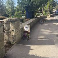 Exit the car park and walk past the pub towards the bridge over the river.