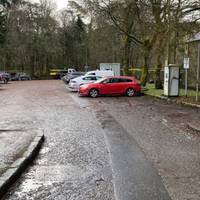 Turn left and walk through the village car park.