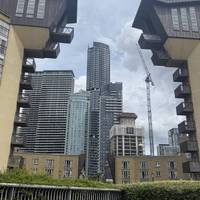 Continue along the river and the many residential buildings.