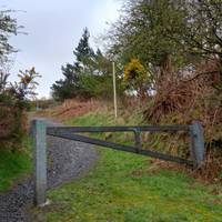 Turn left through this gate and up the hill into the park.