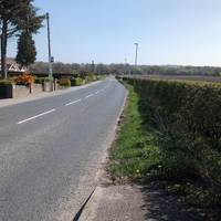 The pavement here runs out and you may want to cross the road to continue along the pavement a little further