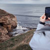 Park up and walk along the heights of the cliff edges and hear the roar of the tide crashing in and out of the caves