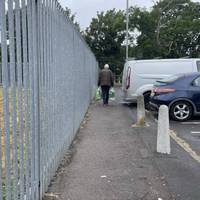 When you reach the car park, keep to the tarmac path on the left hand side. There’s a metal fence to your left.