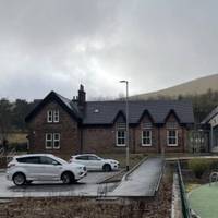 Cross the road at the entrance to The Old Schoolhouse. A great new community hub.