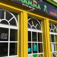 Three generations cook up signature Caribbean food under the watch of Mamma P, with a nod to their Jamaican heritage.
