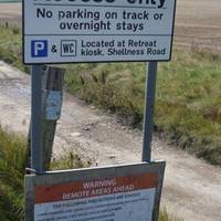 Either drive down the bumpy unmade road or park before and walk along the top.