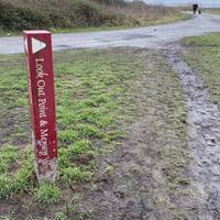 Walk towards the red trail marker to begin following the gravel path. We’ll be following these throughout the route!