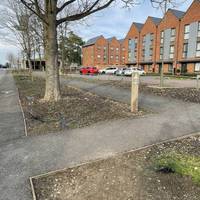 Follow the tarmac path to the right and then immediately left.